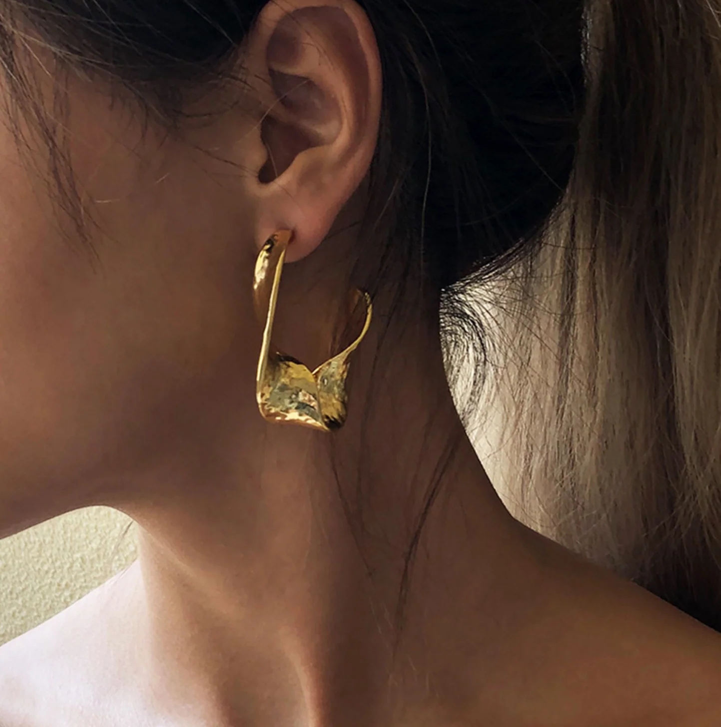 Twisted Hammered Bold Gold Earrings - Image 2